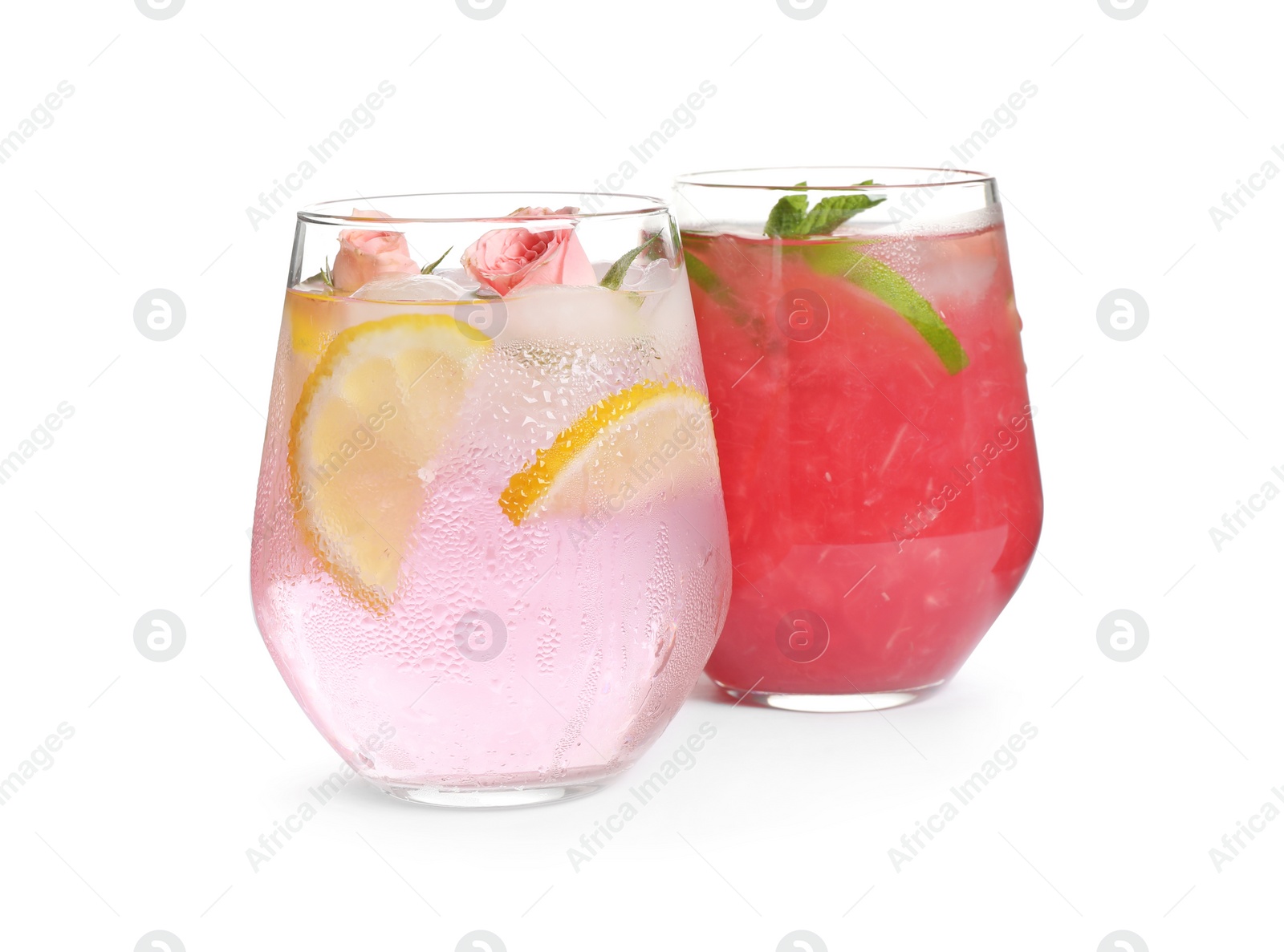 Photo of Glasses of tasty refreshing drinks on white background