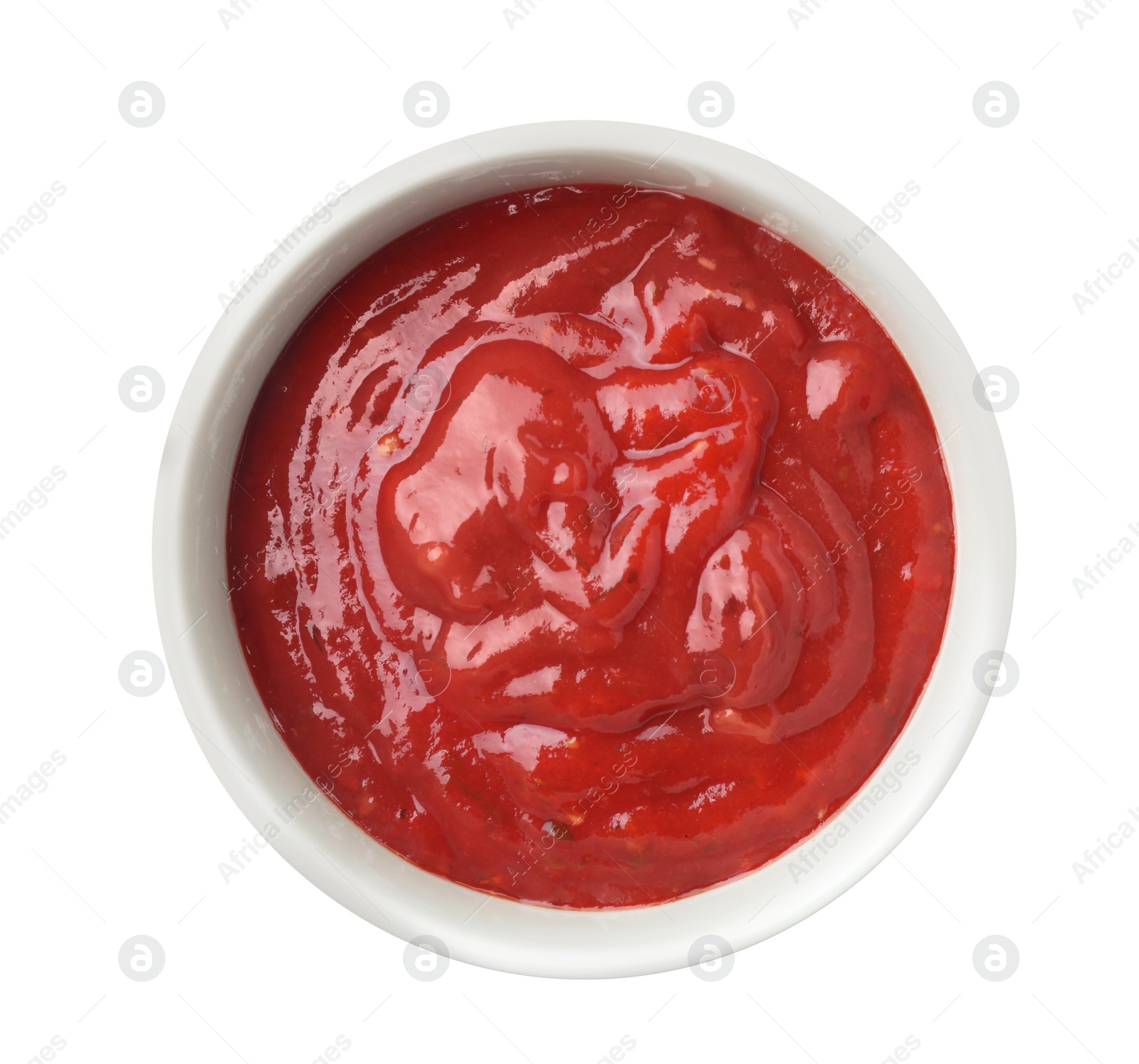 Photo of Bowl with red sauce isolated on white, top view