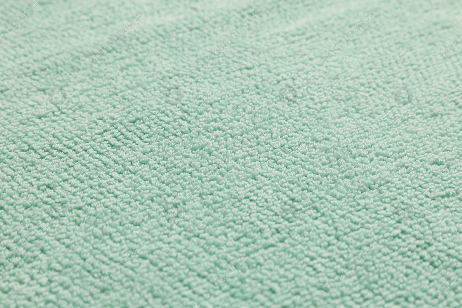 Photo of Soft terry towel as background, closeup view