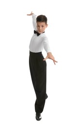 Beautifully dressed little boy dancing on white background