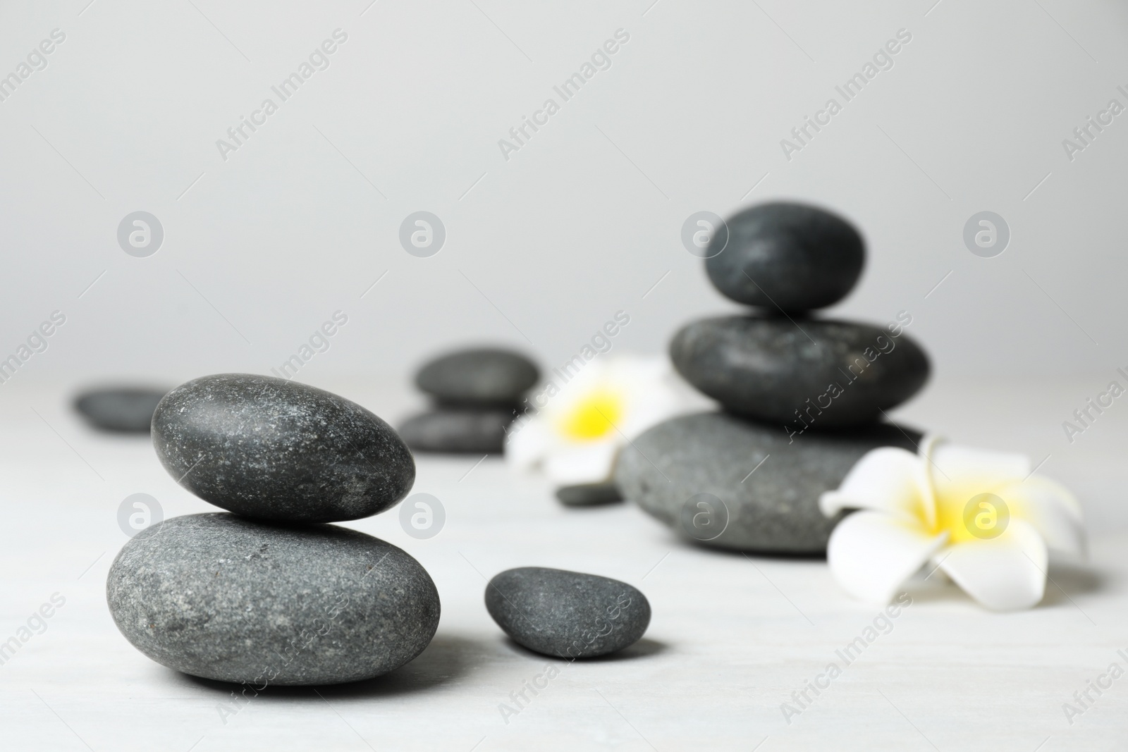 Photo of Composition with spa stones on table. Space for text