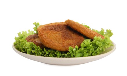 Plate of delicious fried breaded cutlets with lettuce isolated on white