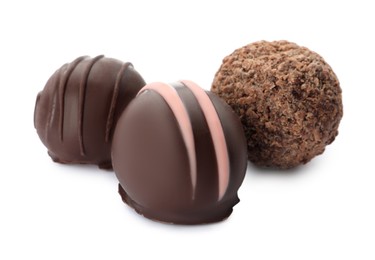 Photo of Many different delicious chocolate truffles on white background