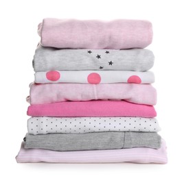 Stack of clean girl's clothes on white background