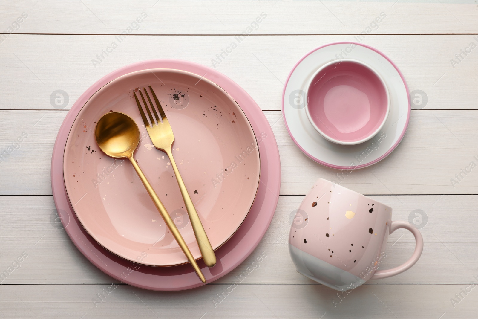 Photo of Stylish empty dishware and cutlery on white wooden table, flat lay