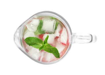 Natural lemonade with mint in glass jug on white background, top view