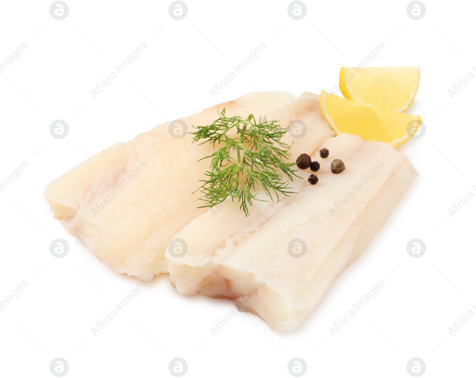 Photo of Pieces of raw cod fish, dill, peppercorns and lemon isolated on white
