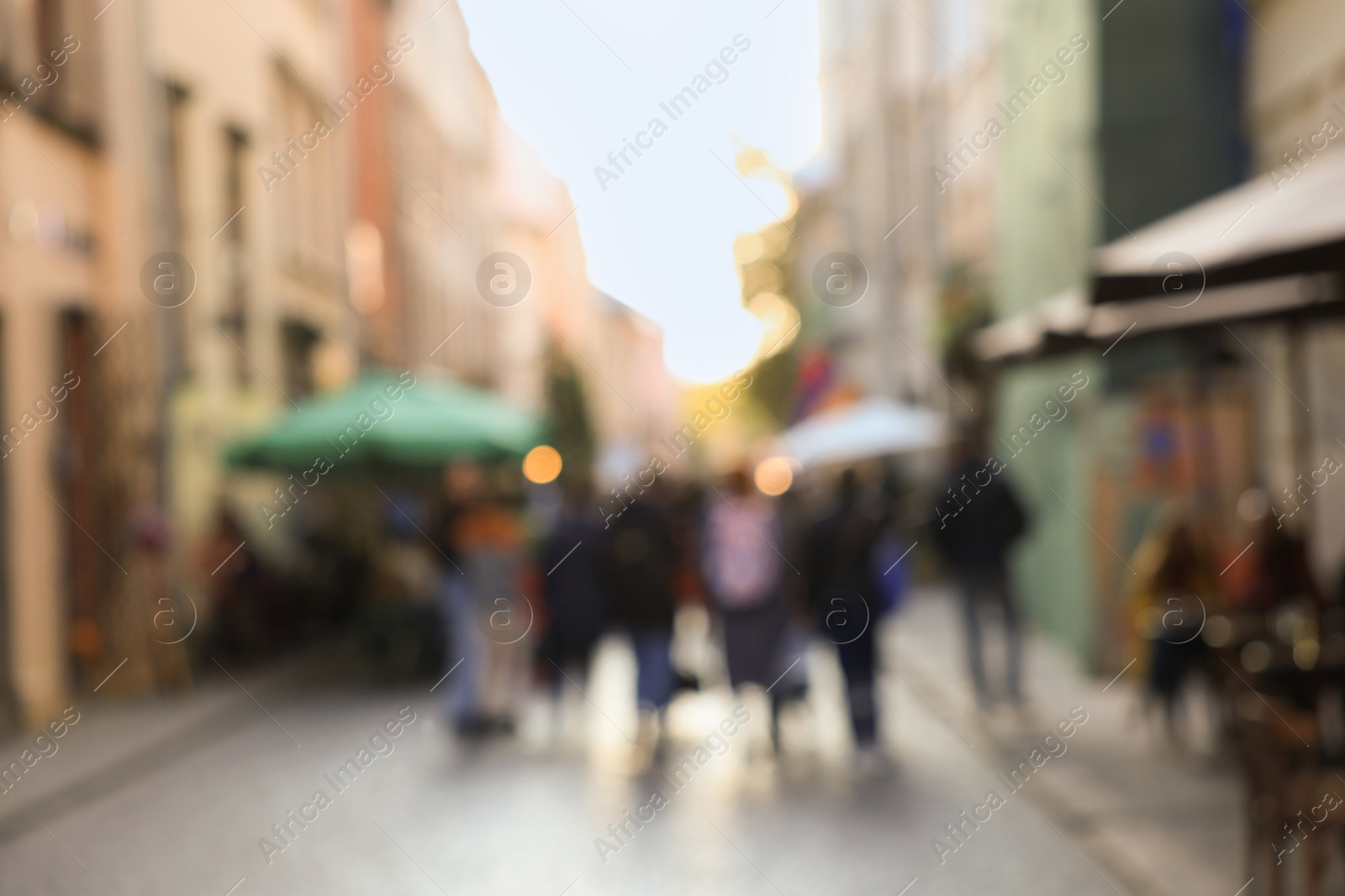 Photo of Blurred view of people walking on city street