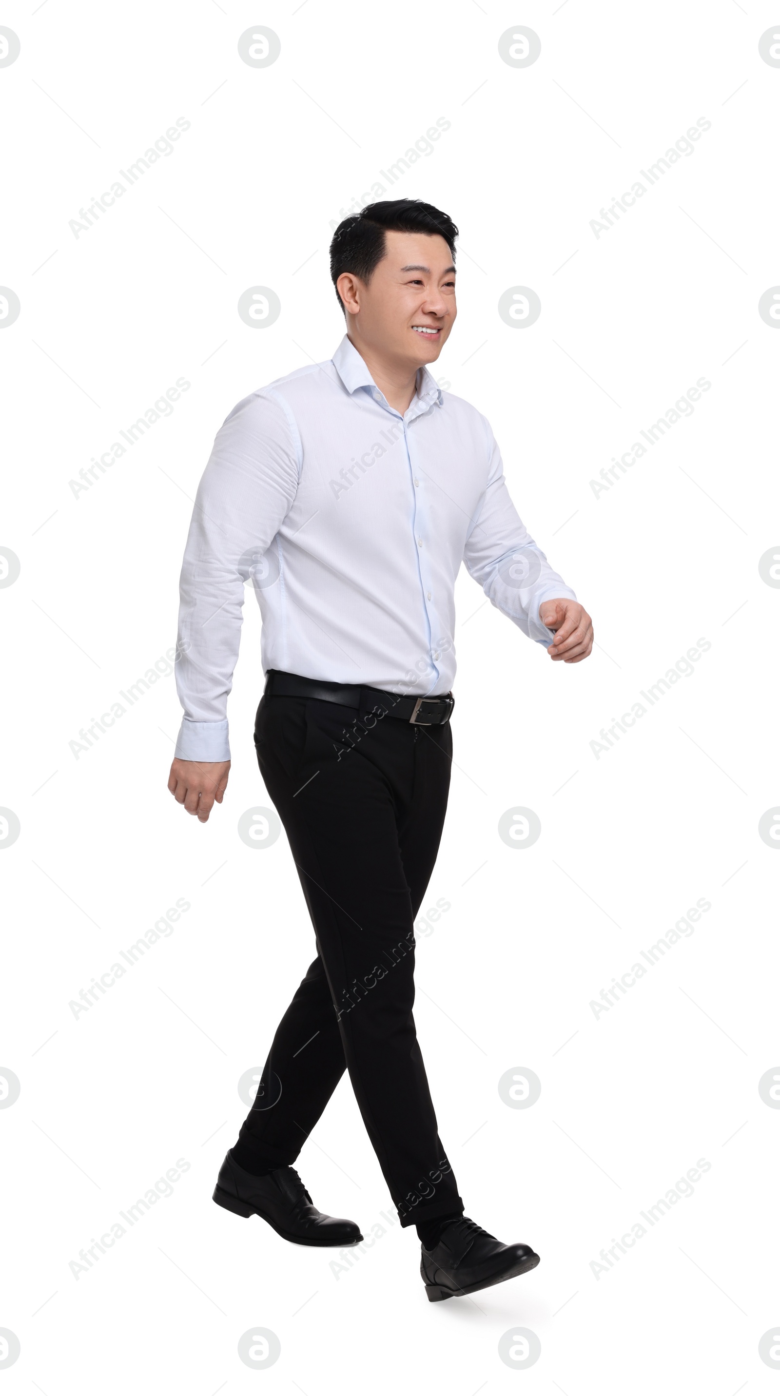 Photo of Businessman in formal clothes walking on white background