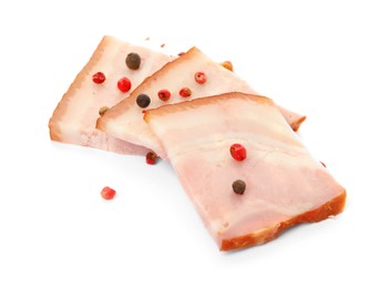 Photo of Delicious smoked bacon with peppercorns on white background