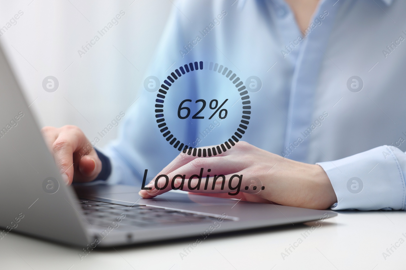 Image of Loading progress. Woman working on laptop at table indoors, closeup