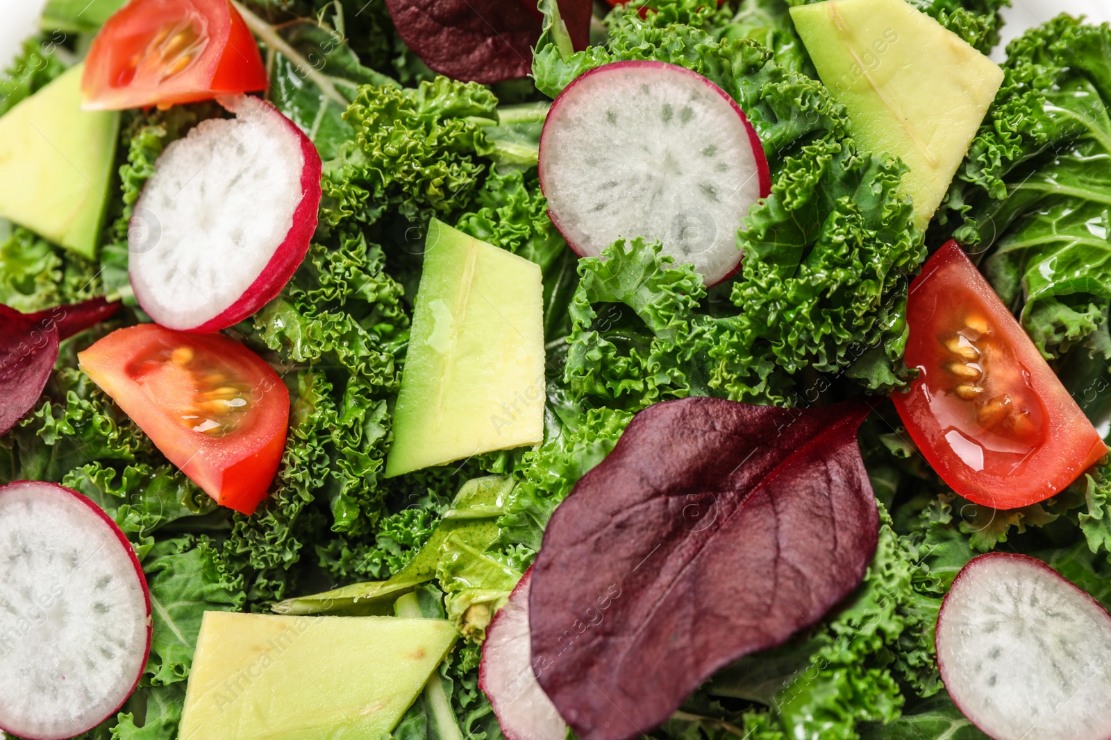 Photo of Delicious salad with kale leaves as background, closeup