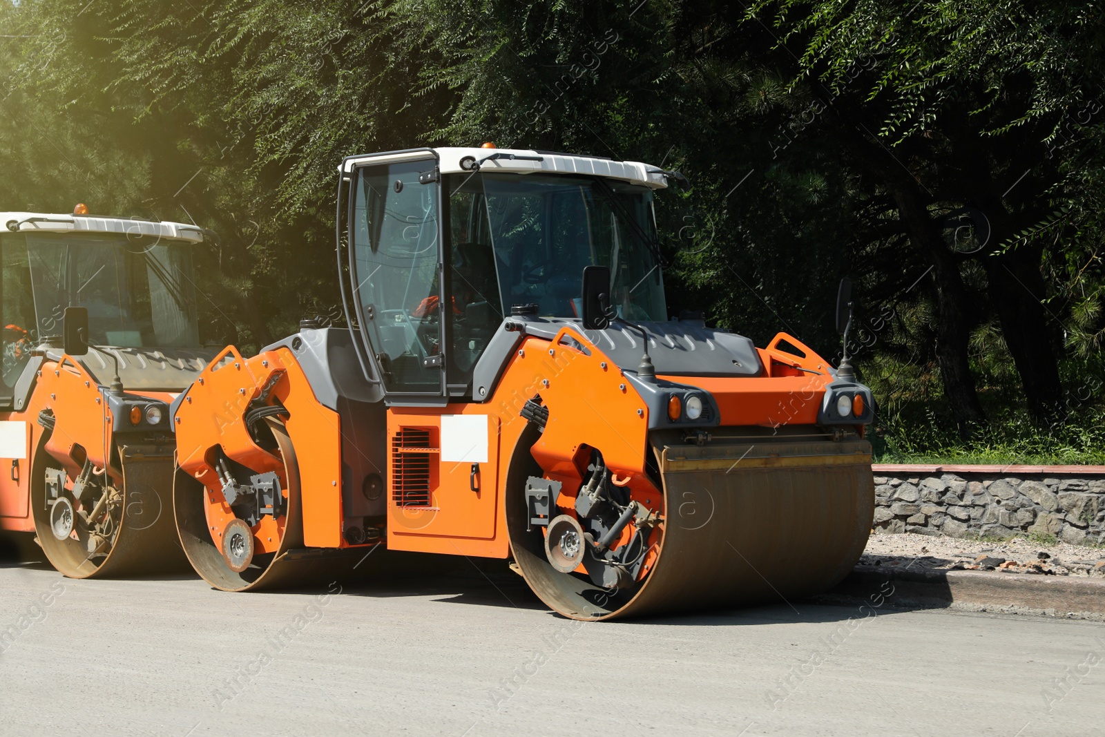 Photo of Modern rollers on city street. Road repair service