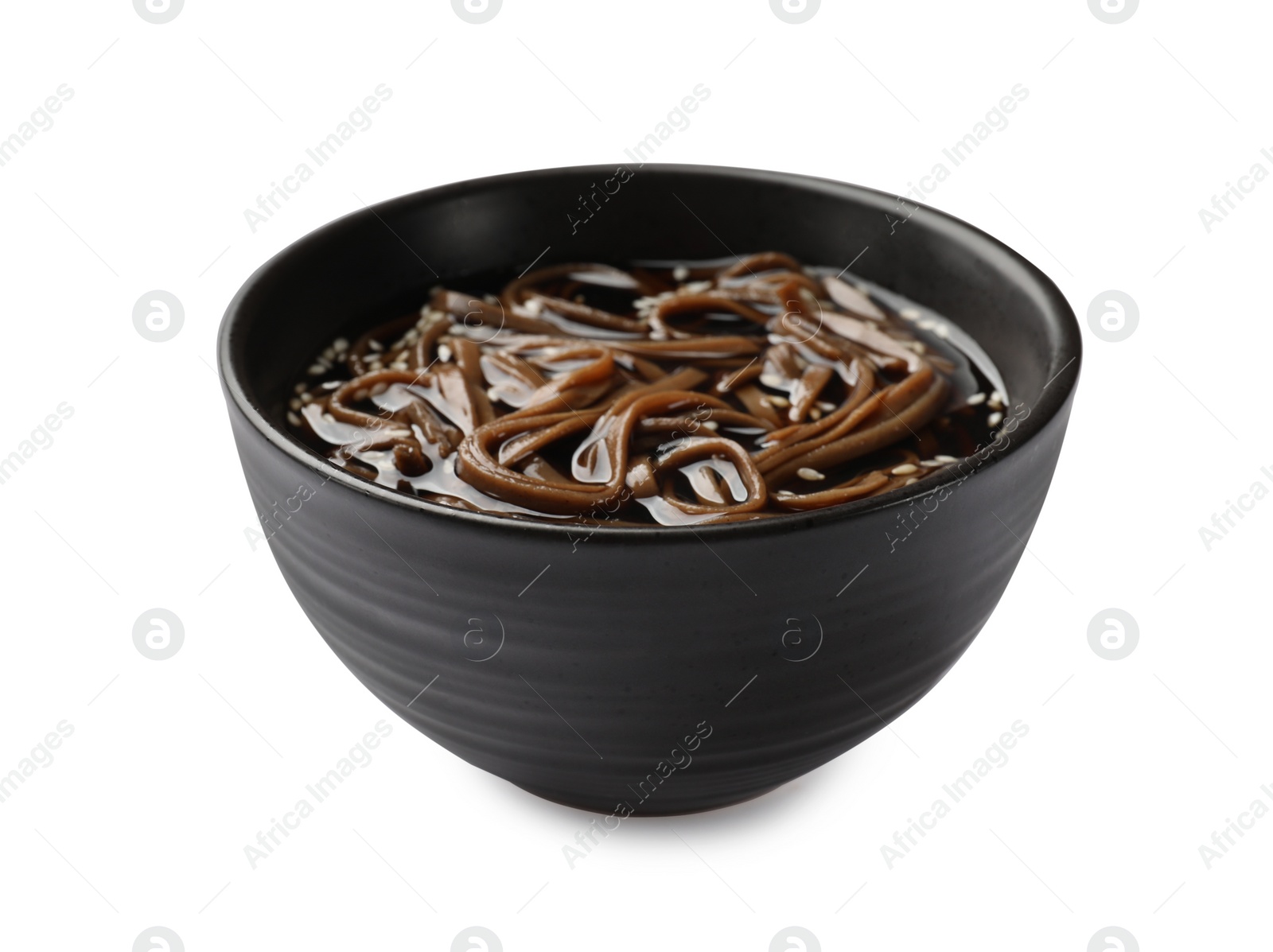 Photo of Tasty soup with buckwheat noodles (soba) in bowl isolated on white