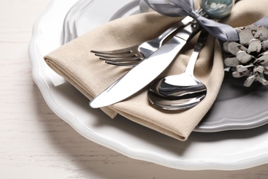 Beautiful Christmas table setting on white wooden background, closeup