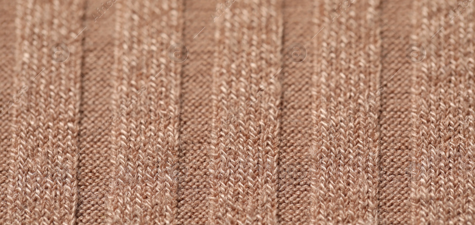 Photo of Texture of soft beige fabric as background, closeup