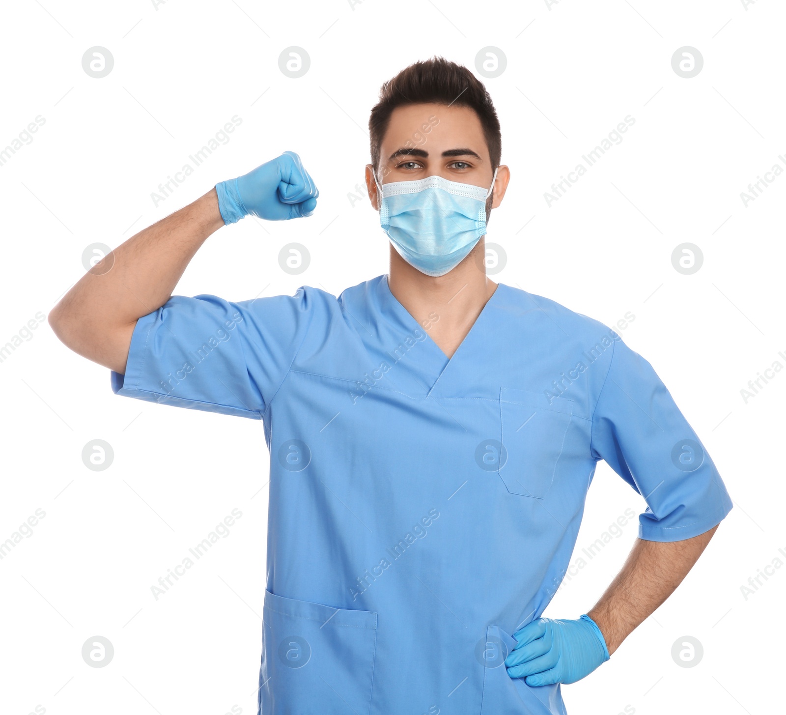 Photo of Doctor with protective mask showing muscles on white background. Strong immunity concept