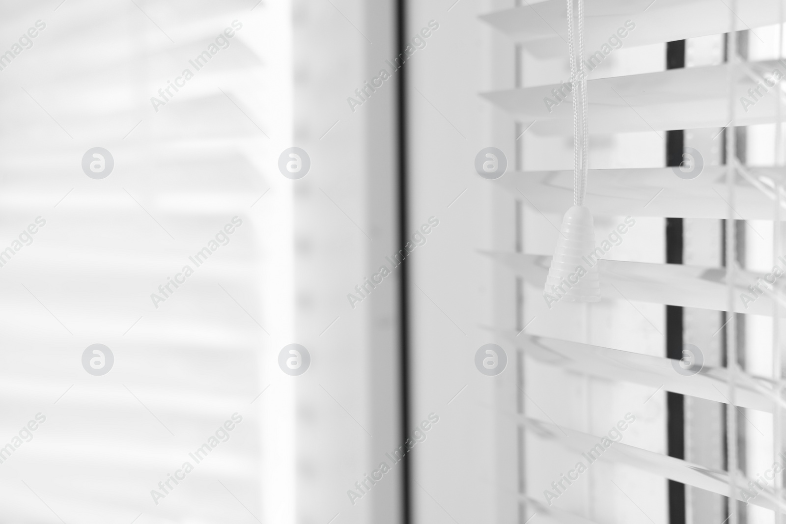 Photo of Closeup view of stylish horizontal window blinds