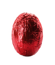 Photo of Chocolate egg wrapped in bright red foil isolated on white