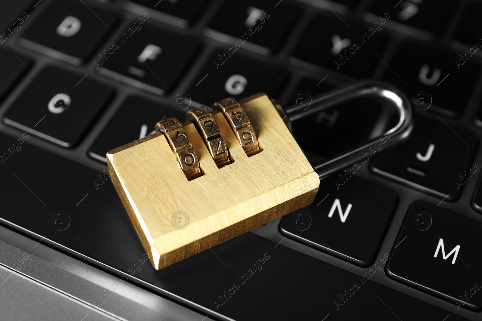 Photo of Cyber security. Padlock on laptop, closeup view