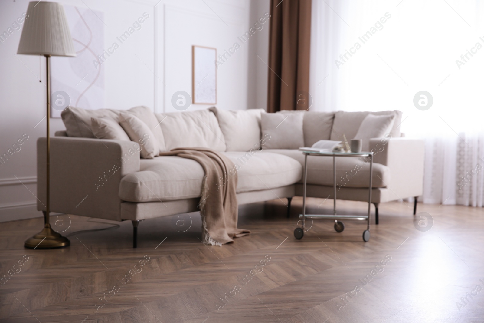 Photo of Modern living room with parquet flooring and stylish furniture