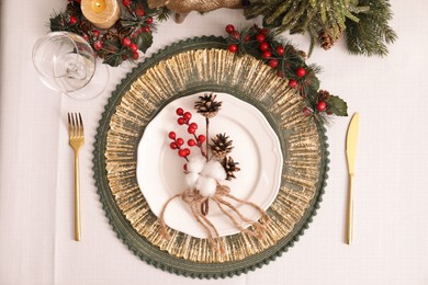 Luxury festive place setting with beautiful decor for Christmas dinner on white table, flat lay