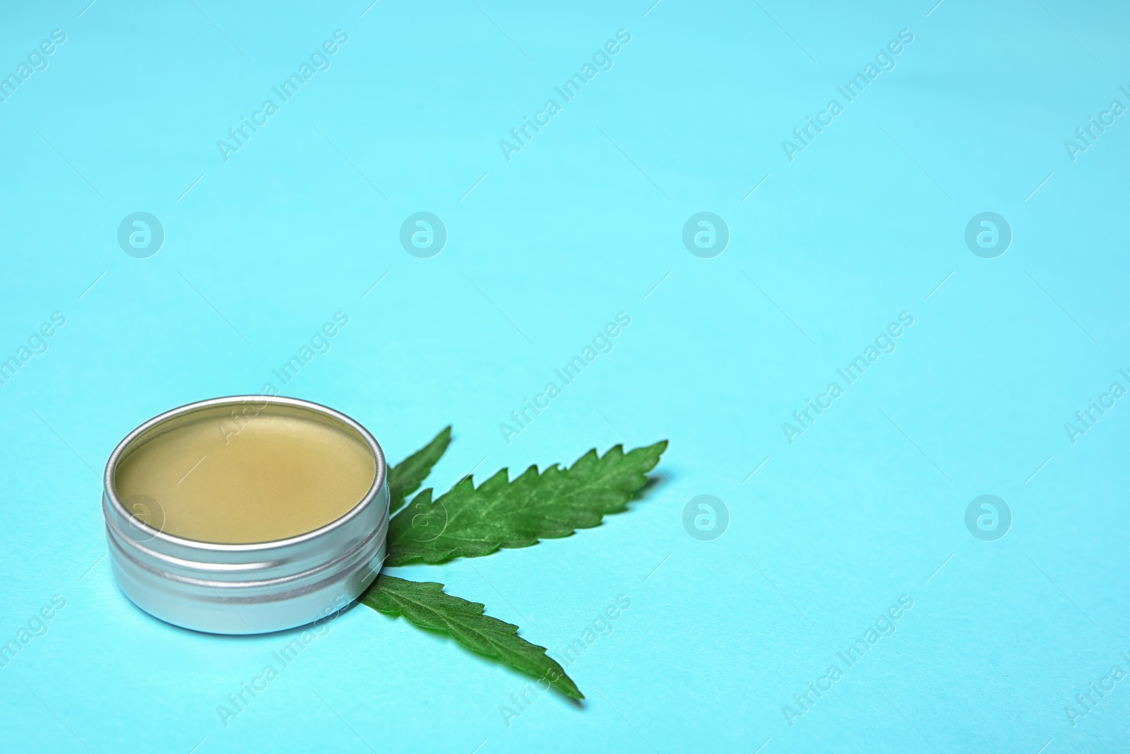 Photo of Jar with hemp lotion and space for text on color background