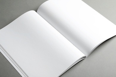 Photo of Mockup of open blank brochure on grey background