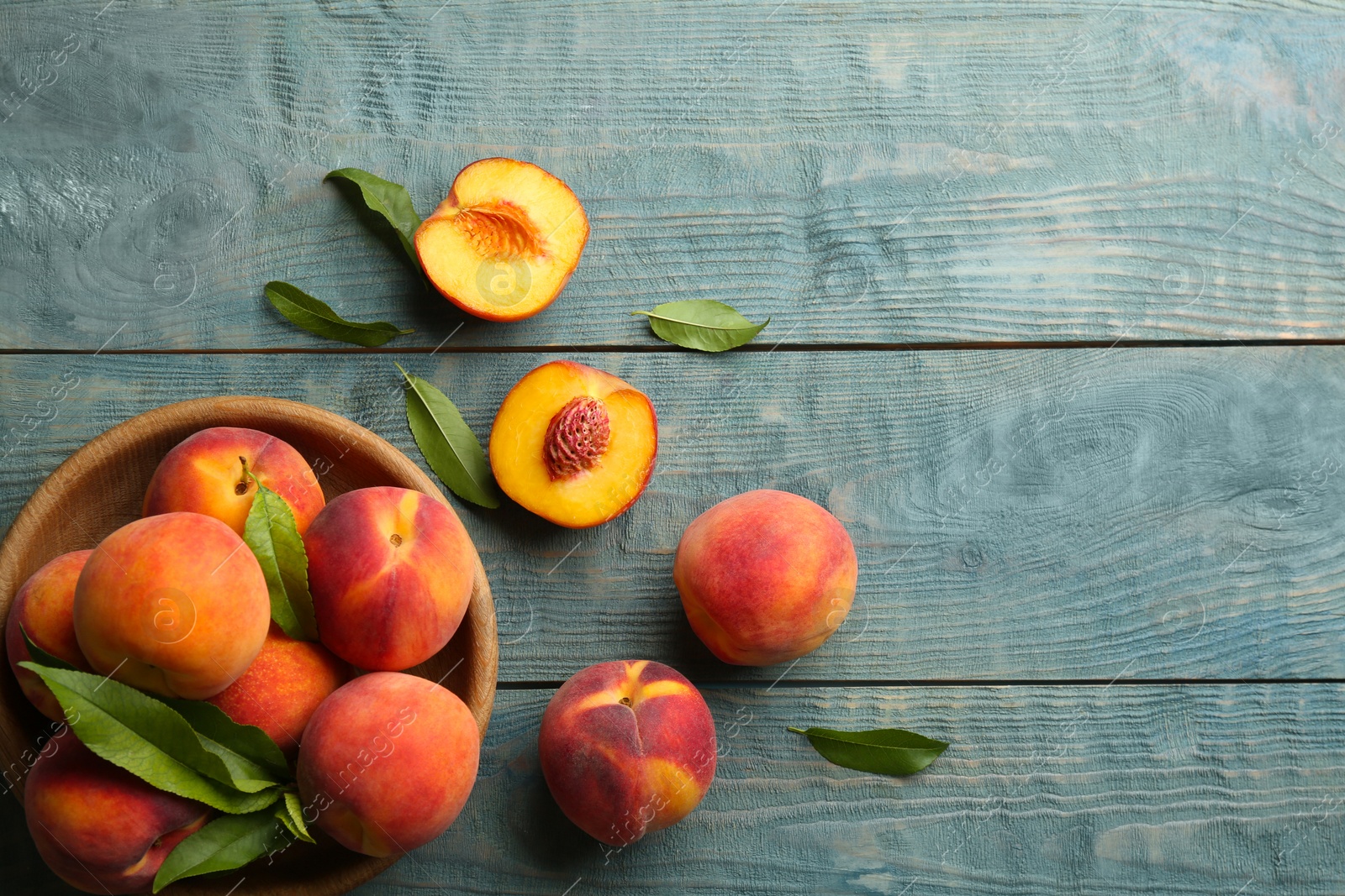 Photo of Fresh sweet peaches on wooden table, flat lay. Space for text