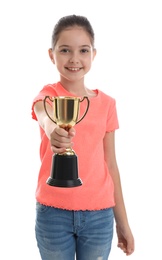 Happy girl with golden winning cup isolated on white