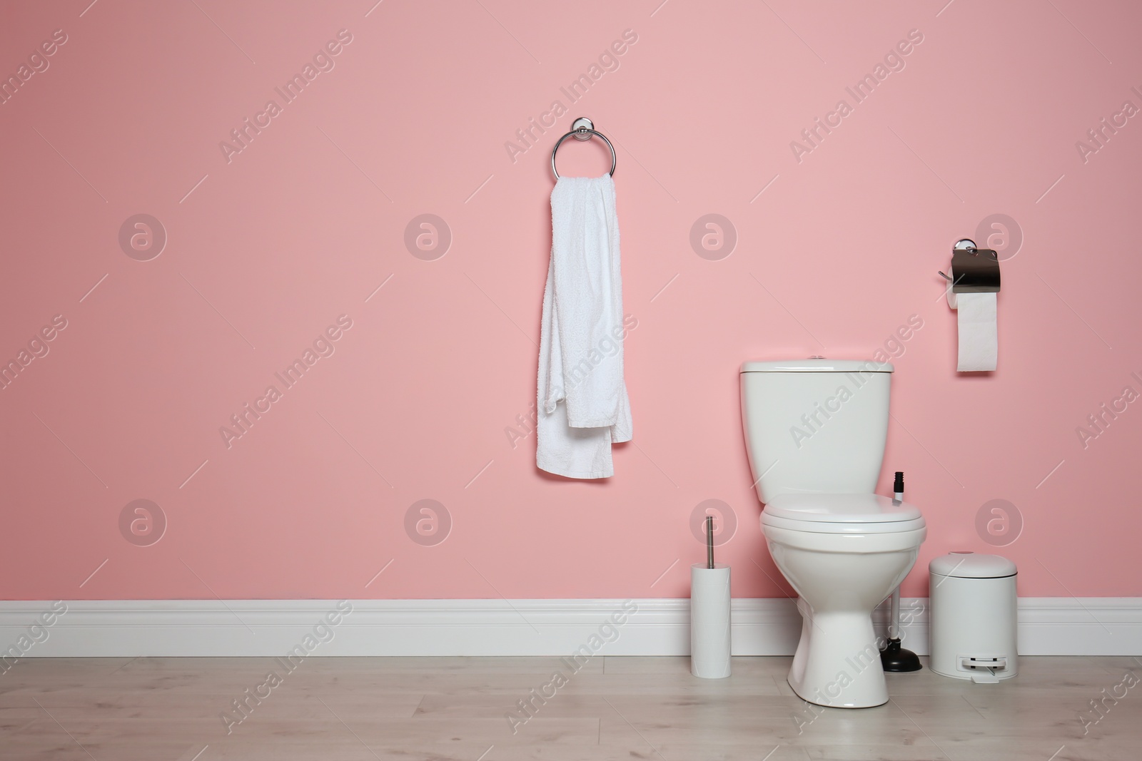 Photo of New ceramic toilet bowl in modern bathroom with space for text