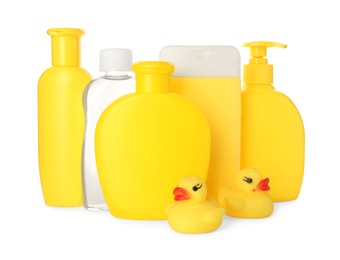 Set of baby cosmetic products and rubber ducks on white background