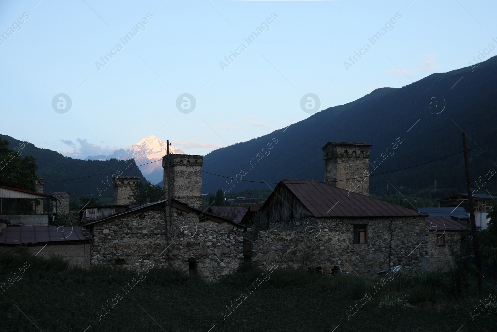 Photo of BATUMI, GEORGIA - AUGUST 13, 2022: Picturesque view of small town near mountain forest