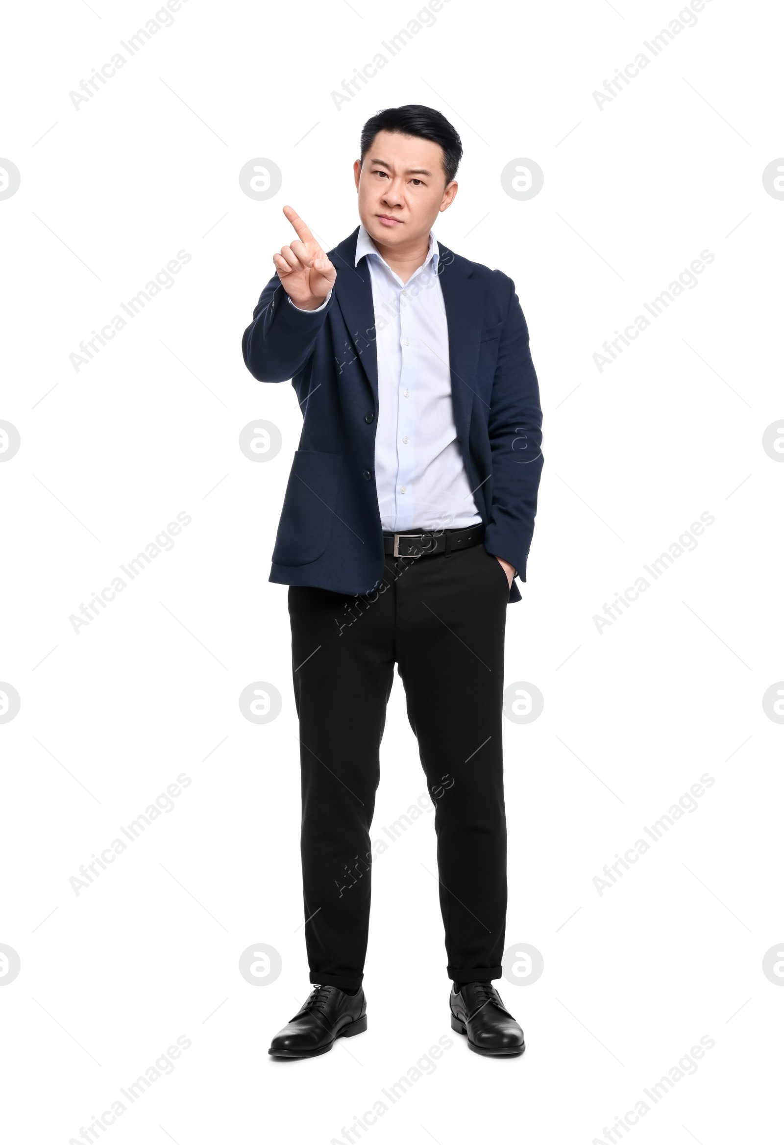 Photo of Angry businessman in suit posing on white background