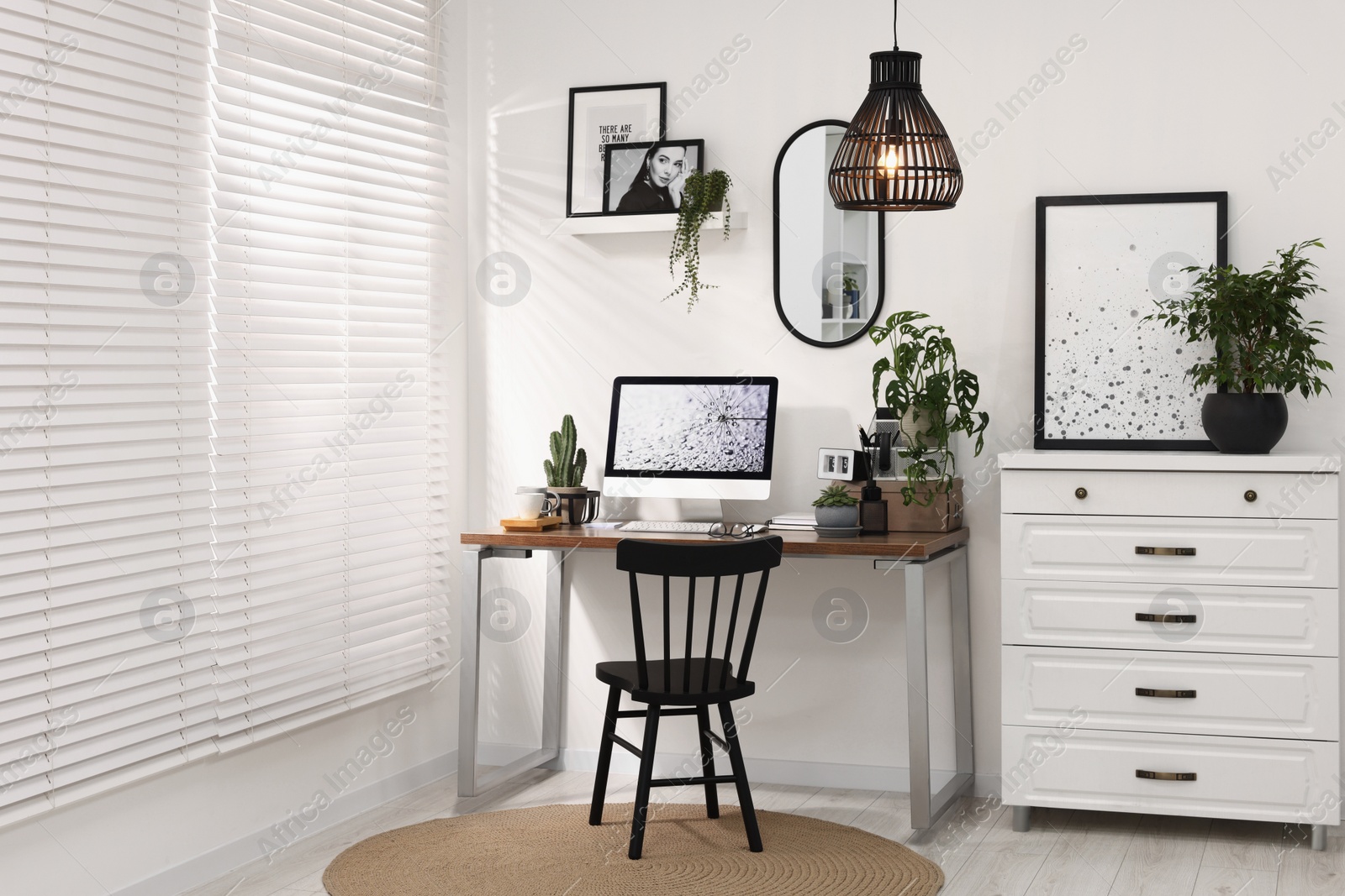 Photo of Cozy workspace with computer on wooden desk at home