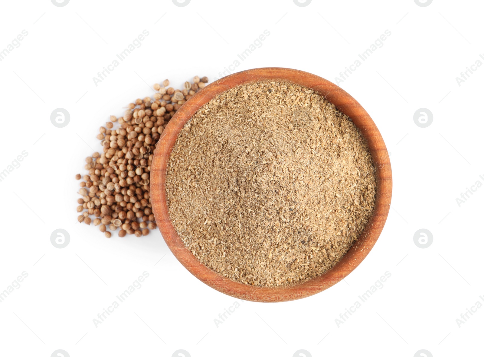 Photo of Wooden bowl with powdered coriander and corns on white background, top view