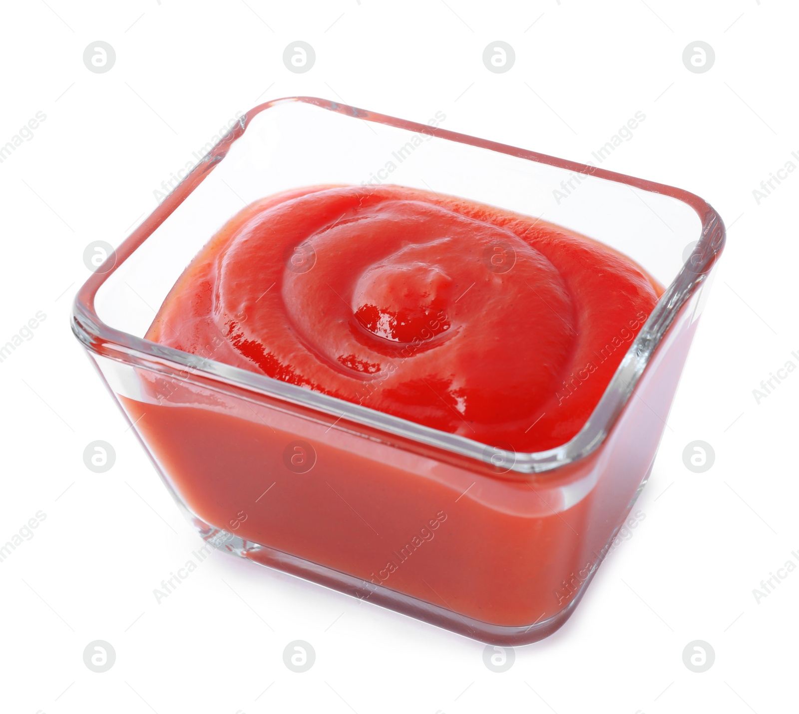 Photo of Tasty tomato sauce in glass bowl isolated on white