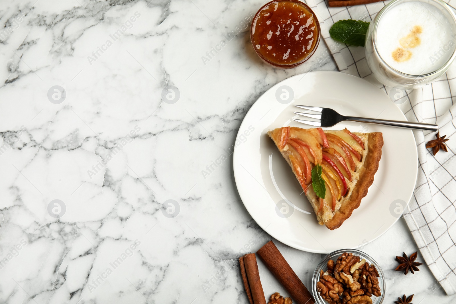 Photo of Delicious apple pie served on white marble table, flat lay. Space for text