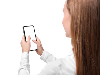 Woman typing message on smartphone against white background, closeup