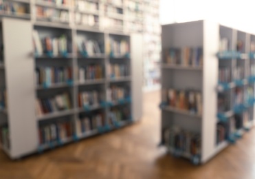 Blurred view of library interior with bookcases