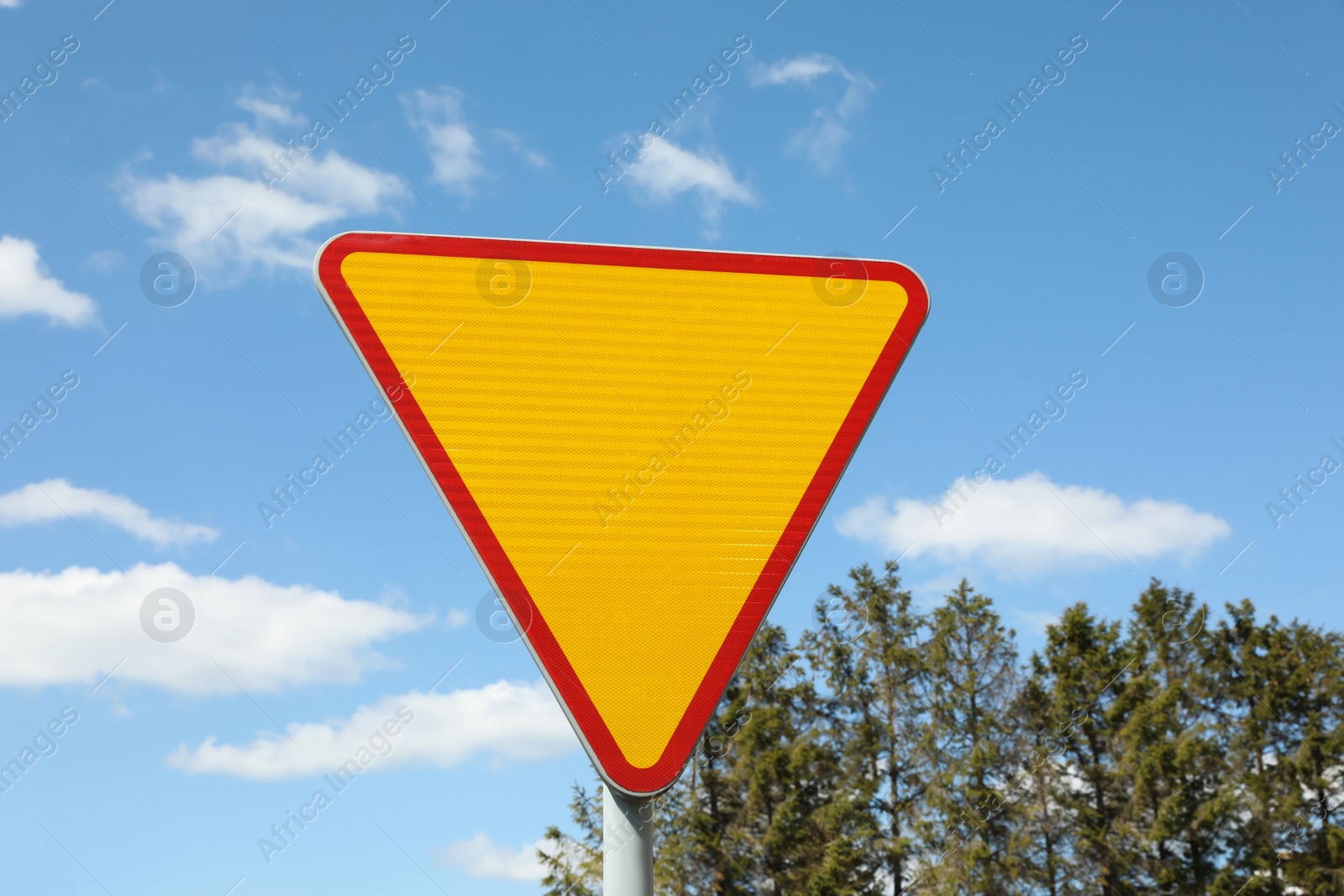 Photo of Traffic sign Yield outdoors on sunny day