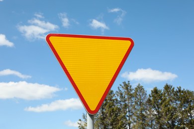 Photo of Traffic sign Yield outdoors on sunny day