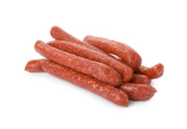 Photo of Many thin dry smoked sausages isolated on white