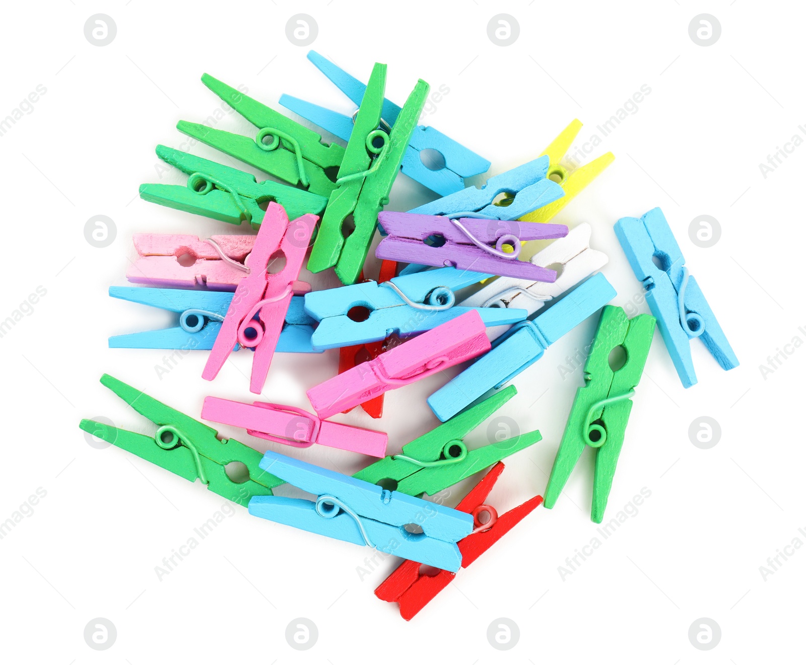 Photo of Pile of colorful wooden clothespins on white background, top view