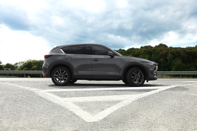 New black modern car on asphalt road
