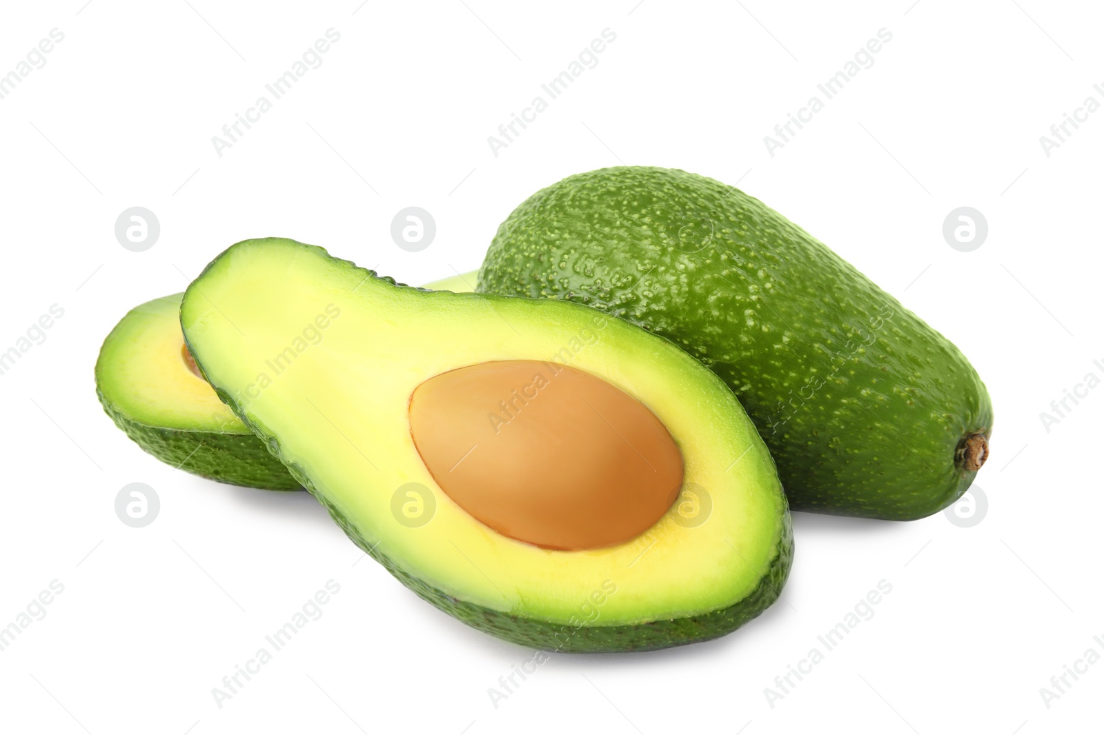 Photo of Tasty ripe avocados on white background. Tropical fruit