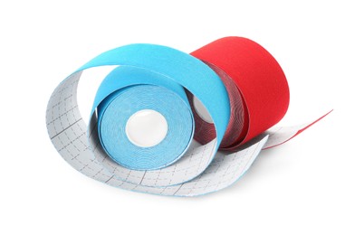 Photo of Bright kinesio tape in rolls on white background