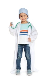 Photo of Cute little child in doctor coat with stethoscope on white background