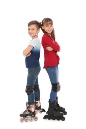 Full length portrait of boy and girl with inline roller skates on white background
