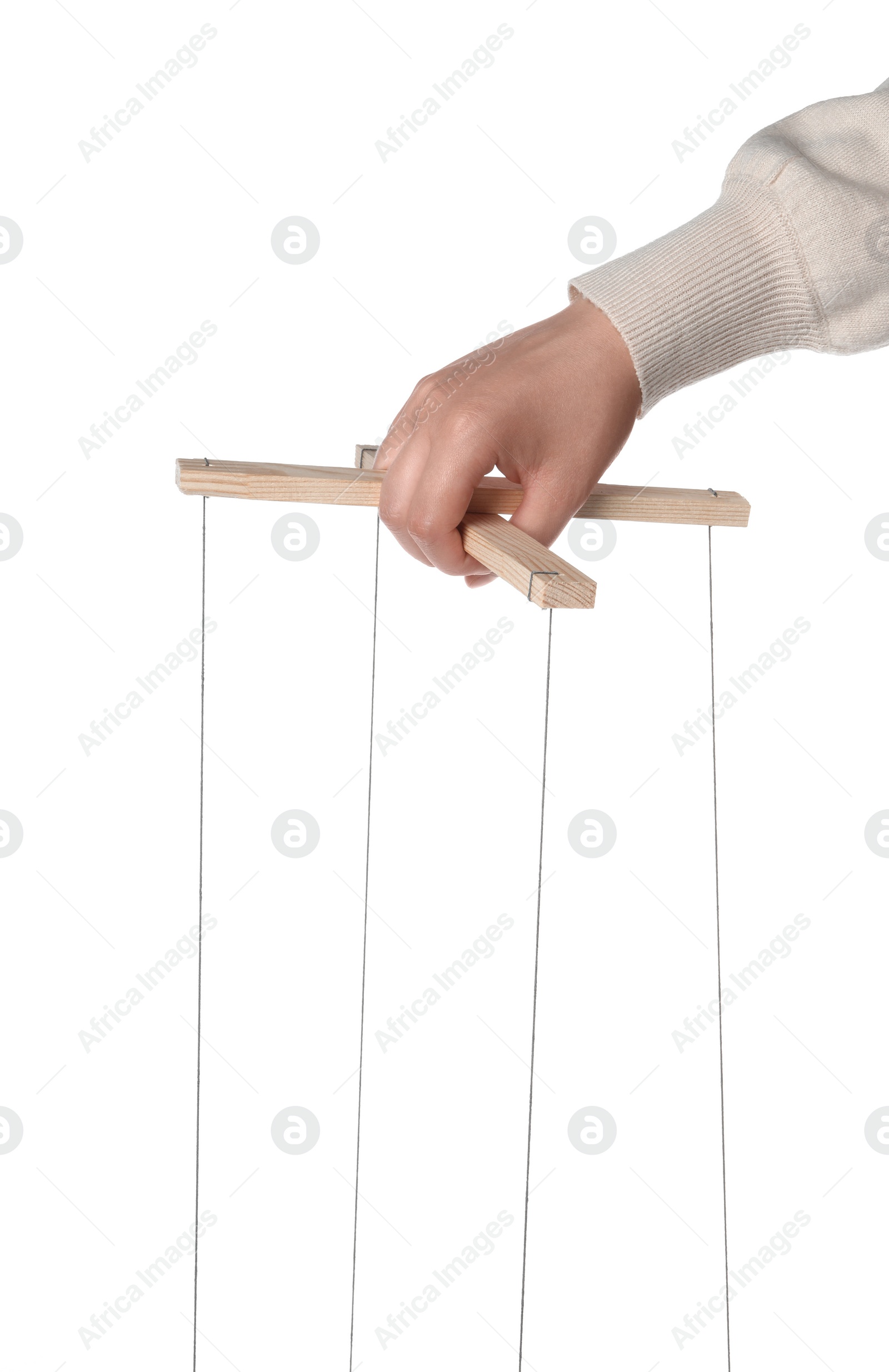 Photo of Woman pulling strings of puppet on white background, closeup